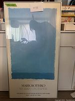 Front view of framed Mark Rothko poster showing abstract blue composition and exhibition details