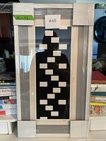 Front view of matted serigraph print in silver-tone frame with protective corner guards