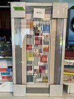 Front view of framed print showing overall condition and dimensions label