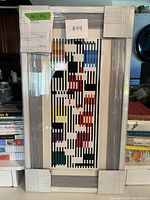 Front view of framed serigraph wrapped in protective corners