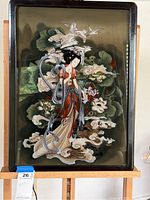 Full view of the reverse glass painting featuring a Japanese woman in a traditional kimono with cranes and lotus flowers, set in a polished rosewood frame.