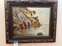 Frontal photo of the entire framed painting showing coastal landing scene.