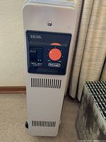 Front view showing control panel with power switch and temperature dial.