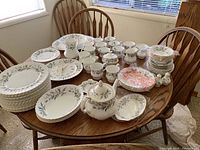 Overview of entire Royal Albert Brigadoon set arranged on wooden table