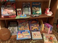 Overview of various toys from multiple franchises displayed on shelf including Toy Story, Littlest Pet Shop, Sherlock Holmes, and others.