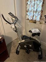 Full side view of Bladez Fitness SC3i exercise bike with adjustable handlebars, seat, and digital monitor on top.