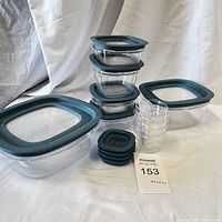 Photo showing the entire set with containers stacked and lids grouped next to them.