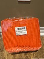 Photo showing front view of orange bubble polymailers pack with label indicating they are new and made in China.