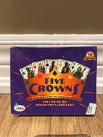 Front view of Five Crowns card game box showing game title, cards, and packaging condition