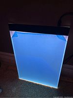 Lightboard glowing blue when plugged in, showcasing illumination