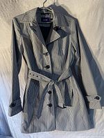 Front view of MEXX women's lightweight gingham jacket showing button closure and belt detail.