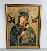 Frontal image of the framed religious print showing the Madonna and Child with angels, with the frame visible and minor wear.