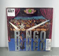Front cover of Ringo Starr vinyl album showing theatrical stage design with 'Ringo' in large marquee letters.
