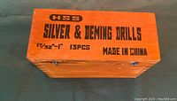 Closed wooden box labeled with HSS Silver & Deming Drills 17/32 - 1 inch, 13 pieces, made in China.
