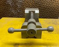 Front view of the precision toolmakers vise showing the two rounded handle ends and jaw faces.