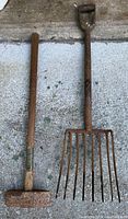 Full view of sledge hammer and hay/potato fork showing overall condition and sizes