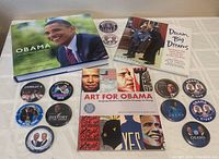 Photo of all items including three books and 12 Obama-Biden 2008 election campaign buttons
