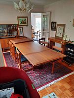 Table in dining room with both leaves attached, viewed at angle