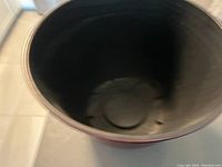 Top view of the pot showing dark interior with some wear marks.