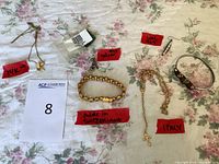 Overview of finished pieces and supplies arranged on floral cloth