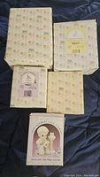 All boxes of Precious Moments figurines showing box pattern and labels confirming vintage collectible status.