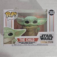 Front view of unopened Funko Pop box featuring The Child figure, showing figure and box condition.