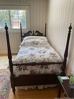 Assembled bed frame in bedroom, showing full structure and proportions