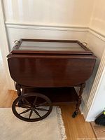 Front view of tea wagon with leaves down and glass tray in place