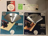 Two Craftsman 10 inch saw blades in packaging with product information and brand labels visible.