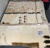 Top view of plush deluxe blanket laid flat, showing overall color and design