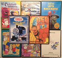 Photo showing all 8 children's DVDs arranged neatly with colorful covers.
