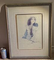 Framed artwork against a wall, includes a soda can for scale; shows full painting, frame and matting.