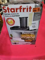 Box for Starfrit Electric Mandoline showing brand, model, and pricing labels.