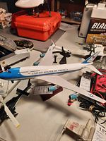 Model plane on a table with other items