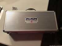 Top view of the aluminum case showing the Align T-Rex 450SE Superior Edition V2 branding plate and handle.