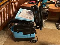 Side view of spotter showing body, hoses and tanks