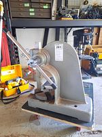 Front view of arbor press mounted on wheeled cart