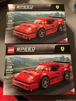 Two sealed LEGO Speed Champions Ferrari F40 Competizione sets 75890, showing front of boxes with car image and LEGO/Ferrari logos