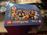 Front of sealed display box showing LEGO Minifigures Disney Series 2 art and branding
