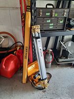 Overview of folded Topcon tripod, hard case, fabric bag