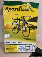 Front view of closed box showing brand, model number, and bike mounting illustration.