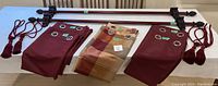 Full lot with curtain rods, three pairs of curtains, and tassel tie-backs