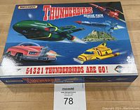 Closed box showing front artwork with the five Thunderbirds vehicles in action and branding.