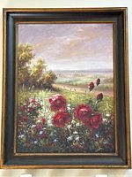 Frontal view of the large original flower and village landscape painting in wide dark frame with gold trim.