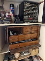 Front view of oak wooden toolbox with drawers partly open