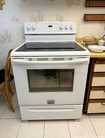 Front view of white Frigidaire Gallery electric range