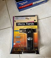 Front view of Micro Torch packaged mini torch showing branding and packaging intact.