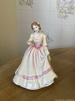 Front view of Royal Doulton Yours Forever figurine showing detailed dress and figure.