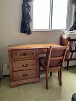 Front view of desk and chair in room