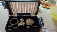Photo of the full silver plated condiment set in the black box with satin lining, showing sugar bowl, mustard pot, horseradish pot, and two spoons.